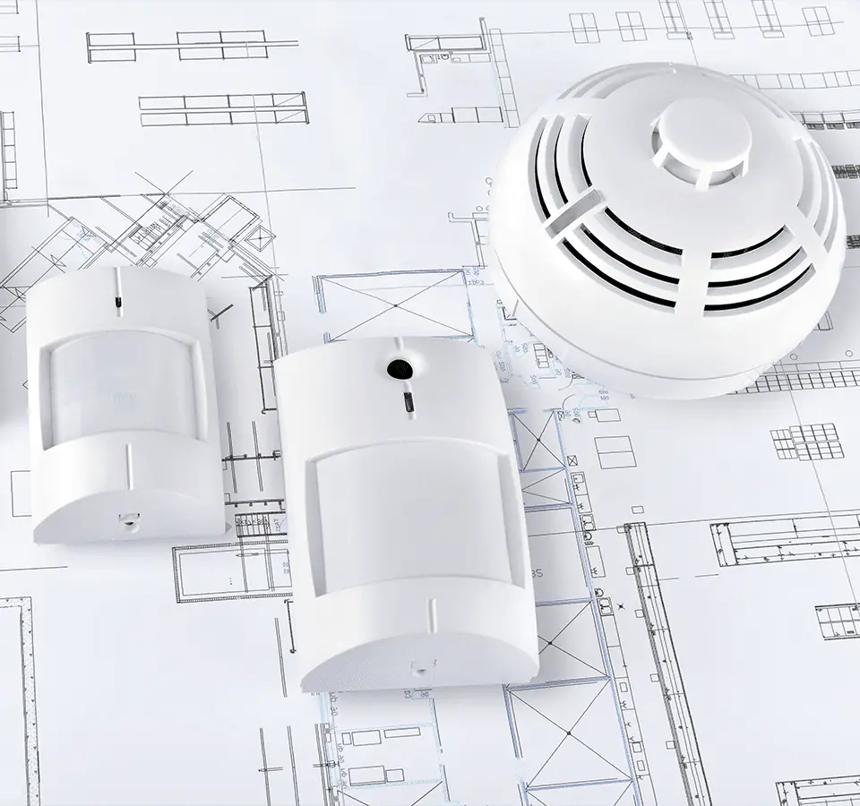 Smart motion and smoke sensors on a house plan